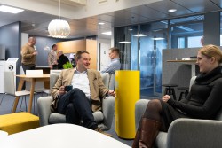 <p><em>Safety at work. The staff can move freely in offices equipped with Genano’s air purifiers, since the air is being disinfected from viruses 24/7. The company’s CEO Niklas Skogsteris having an informal chat with Marketing Manager Marjo Paija.</em></p> (foto: Pekka Niemi)