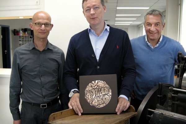 Erwin Heeren, Tom Du Caju and Koen Penne of Du Caju Printing & Packaging proudly display The Origin Box.© Iggesund